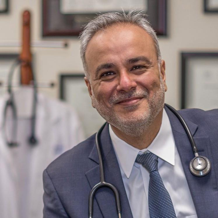 Dr. Saud Anwar, physician, in his medical office